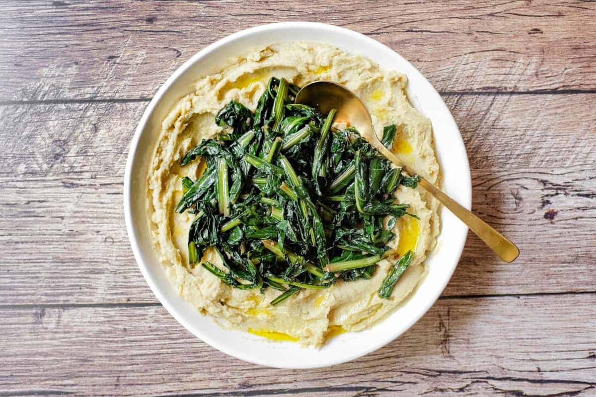 A large platter of fava bean puree (fave e cicoria) with sauteed chicory