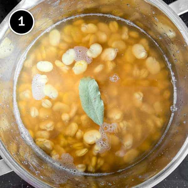 Fave e Cicoria (Puglian Fava Bean Purée with Chicory) | cookeatworld.com Skinned fava beans simmering in a pot.