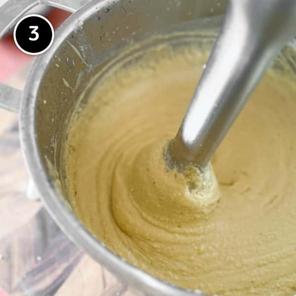 Fave e Cicoria (Puglian Fava Bean Purée with Chicory) | cookeatworld.com An immersion blender making a puree from cooked fava beans.