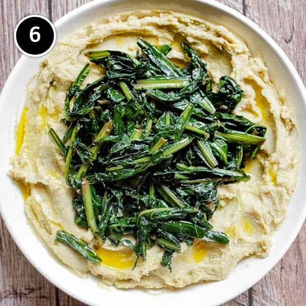 Fave e Cicoria (Puglian Fava Bean Purée with Chicory) | cookeatworld.com A large platter of Fave e Cicoria (Fama Bean Puree with Chicory)