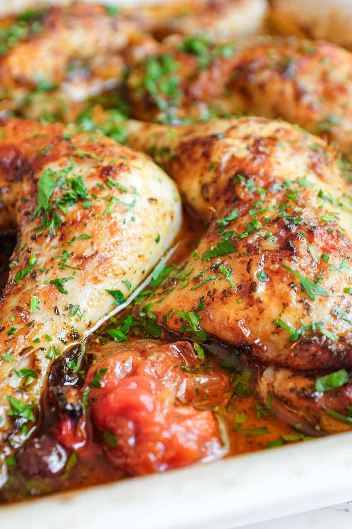 Chicken quarters are served from the dish with harissa sauce containing spices and fragrant preserved lemons.