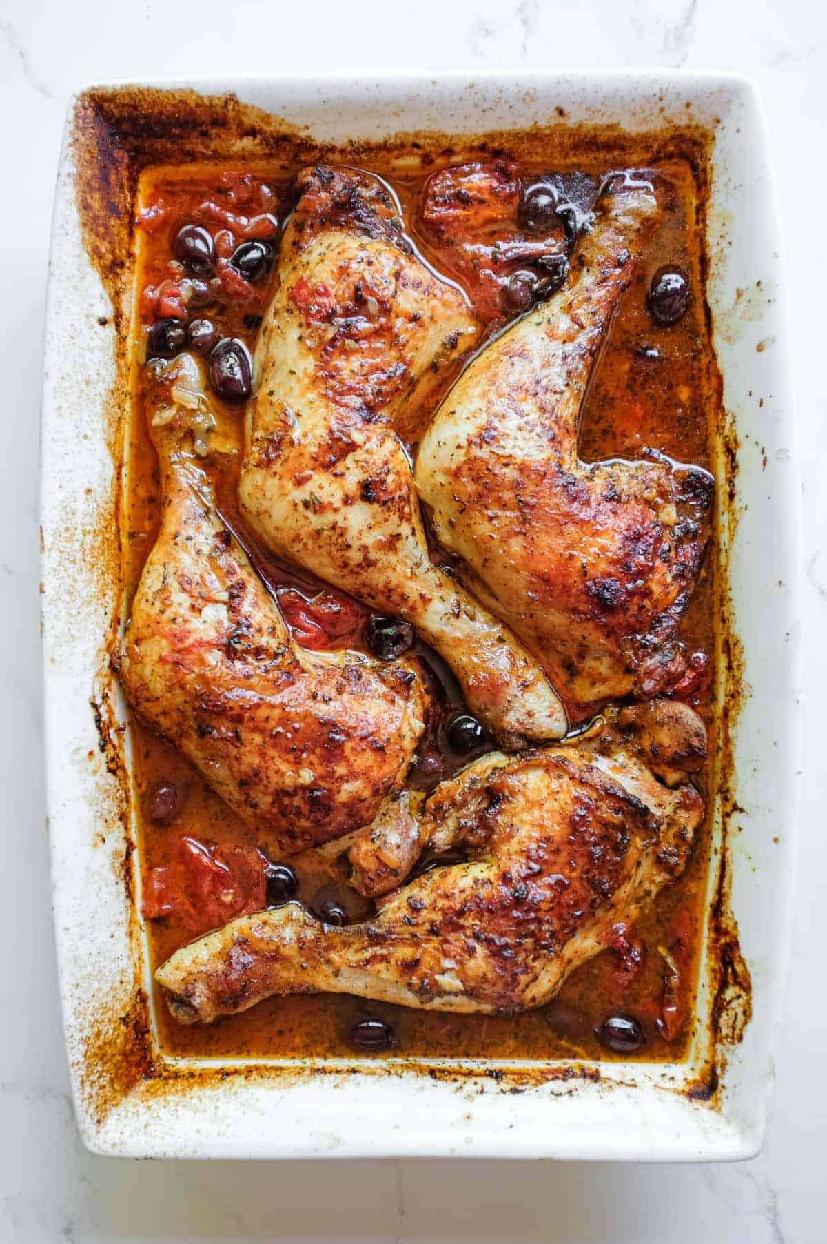 Moroccan harissa chicken direct from the oven in a spiced harissa paste sauce with preserved lemons.