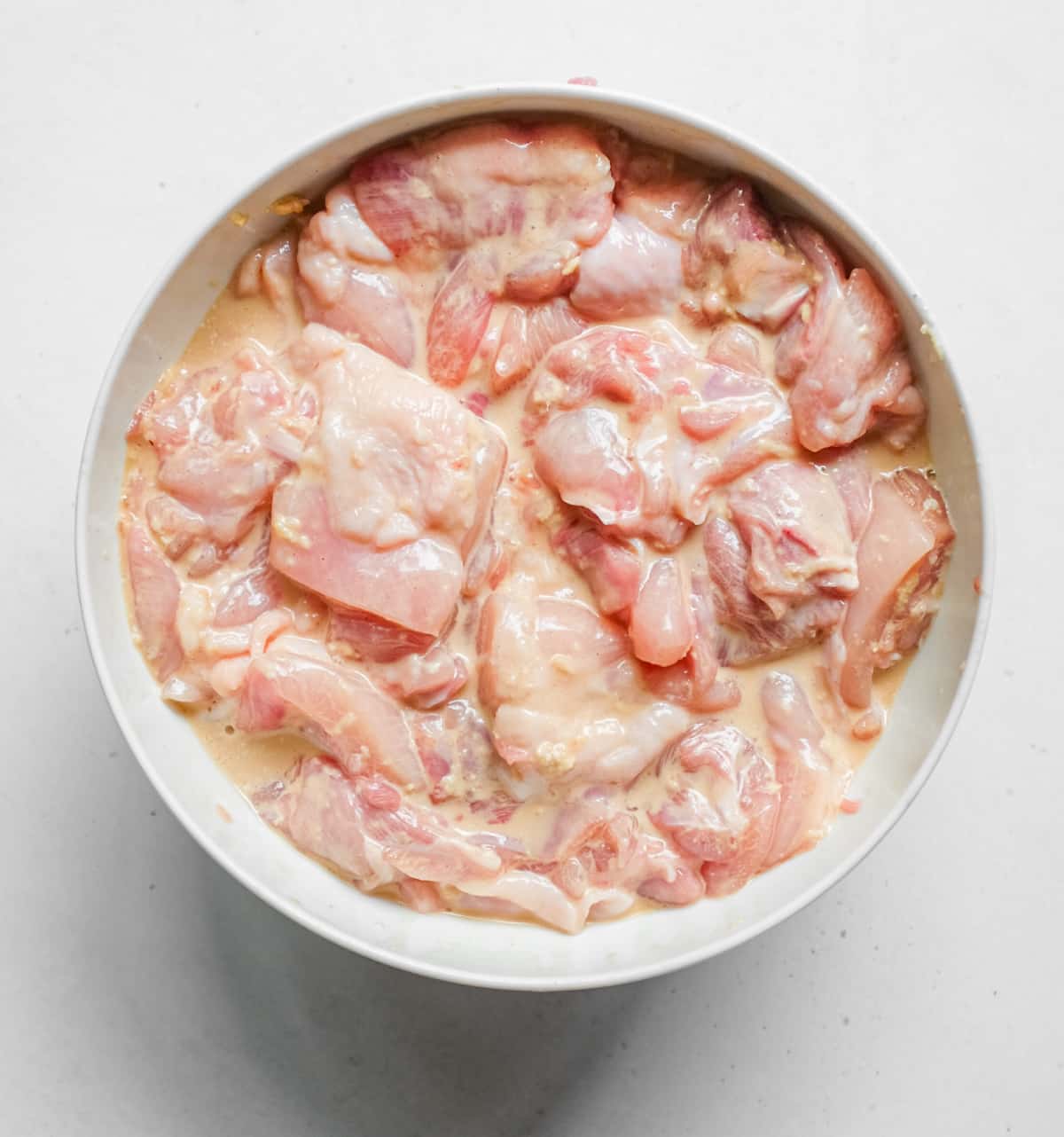 Karaage Chicken (Japanese Fried Chicken) | cookeatworld.com Chicken pieces sit in the special marinade for Karaage fried chicken.