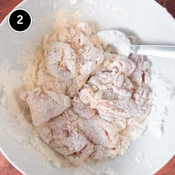 Karaage Chicken (Japanese Fried Chicken) | cookeatworld.com coating karaage chicken pieces in potato starch