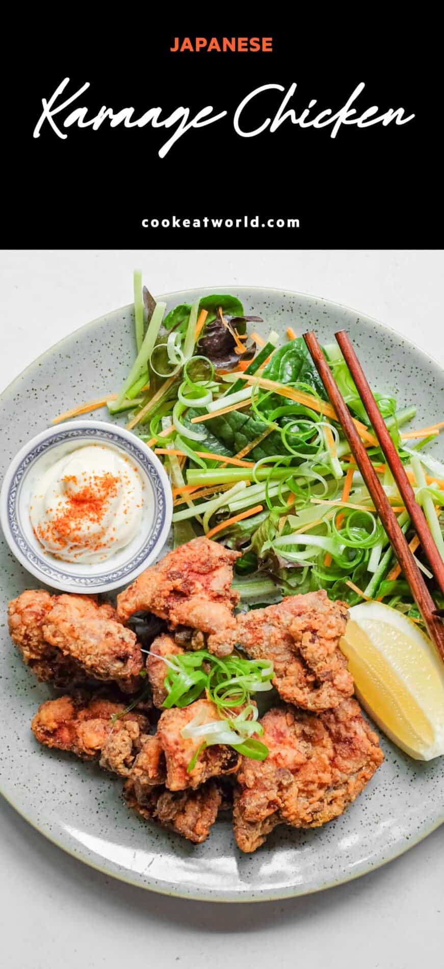 A plate of Japennese karaage chicken with a side salad, lemon wedge, and mayonnaise