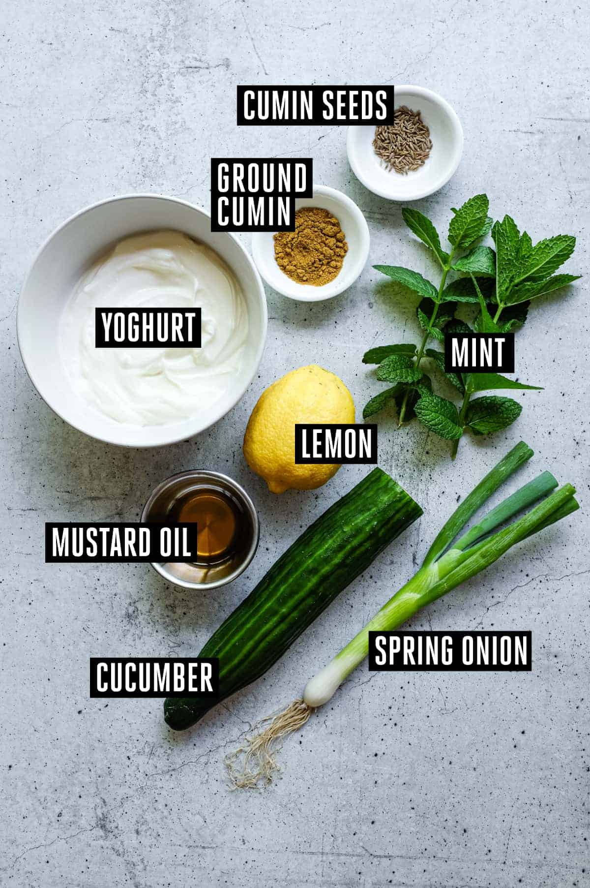 Cucumber Raita | cookeatworld.com The ingredients for Indian cucumber raita: Yoghurt, cucumber, cumin seeds, ground cumin, mint, spring onion, and lemon