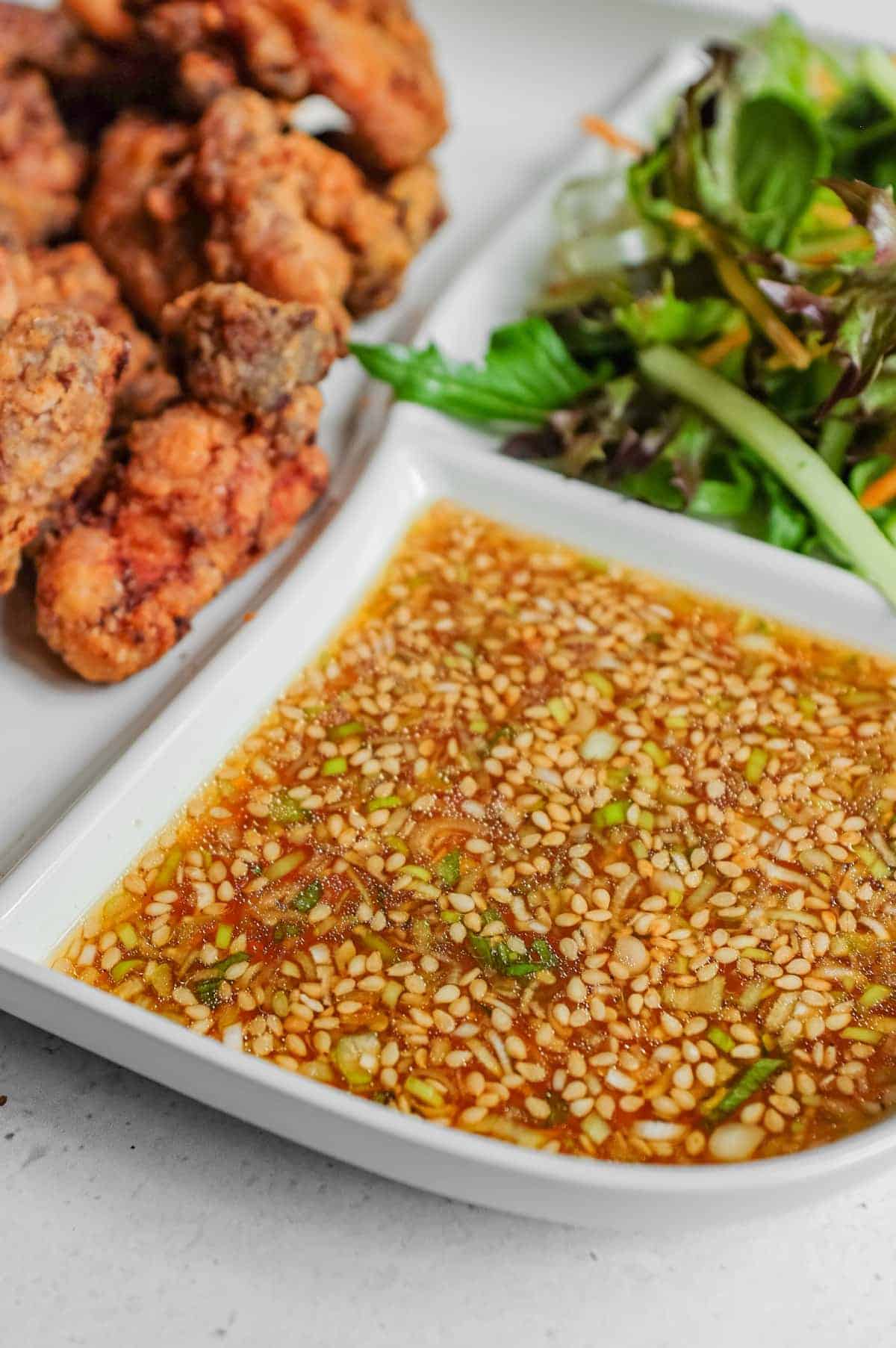 A close up of yurinchi sauce for crisp chicken.