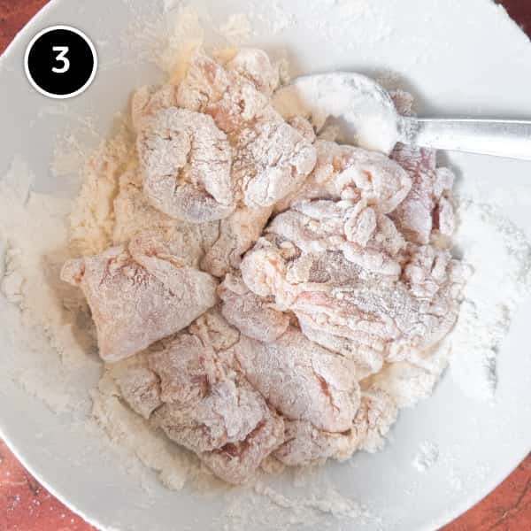 Yurinchi Chicken (Crispy Fried Chicken with Soy Vinegar Sauce) Coating chicken thigh pieces in potato starch