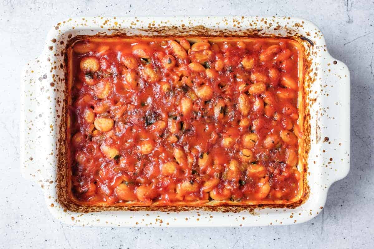Rustic ceramic dish of gigantes plaki greek baked butter beans