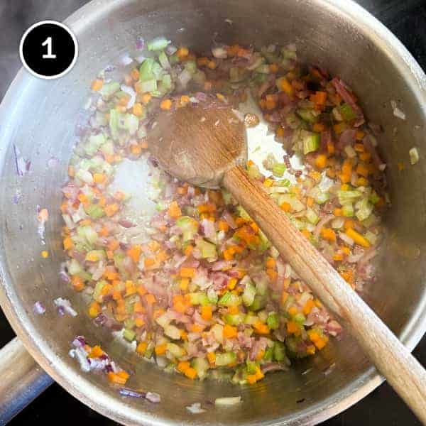 Gigantes Plaki (Quick & Easy Greek Beans in Tomato Sauce) | cookeatworld.com Frying onion, celery, carrot and garlic in a large pan.