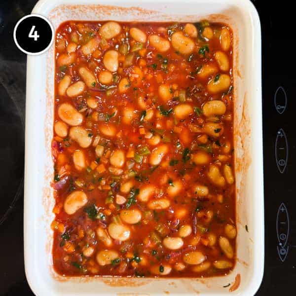 Gigantes Plaki (Quick & Easy Greek Beans in Tomato Sauce) | cookeatworld.com Traditional greek gigantes plaki baked butter beans in tomato sauce transferred to a baking dish for oven baking.