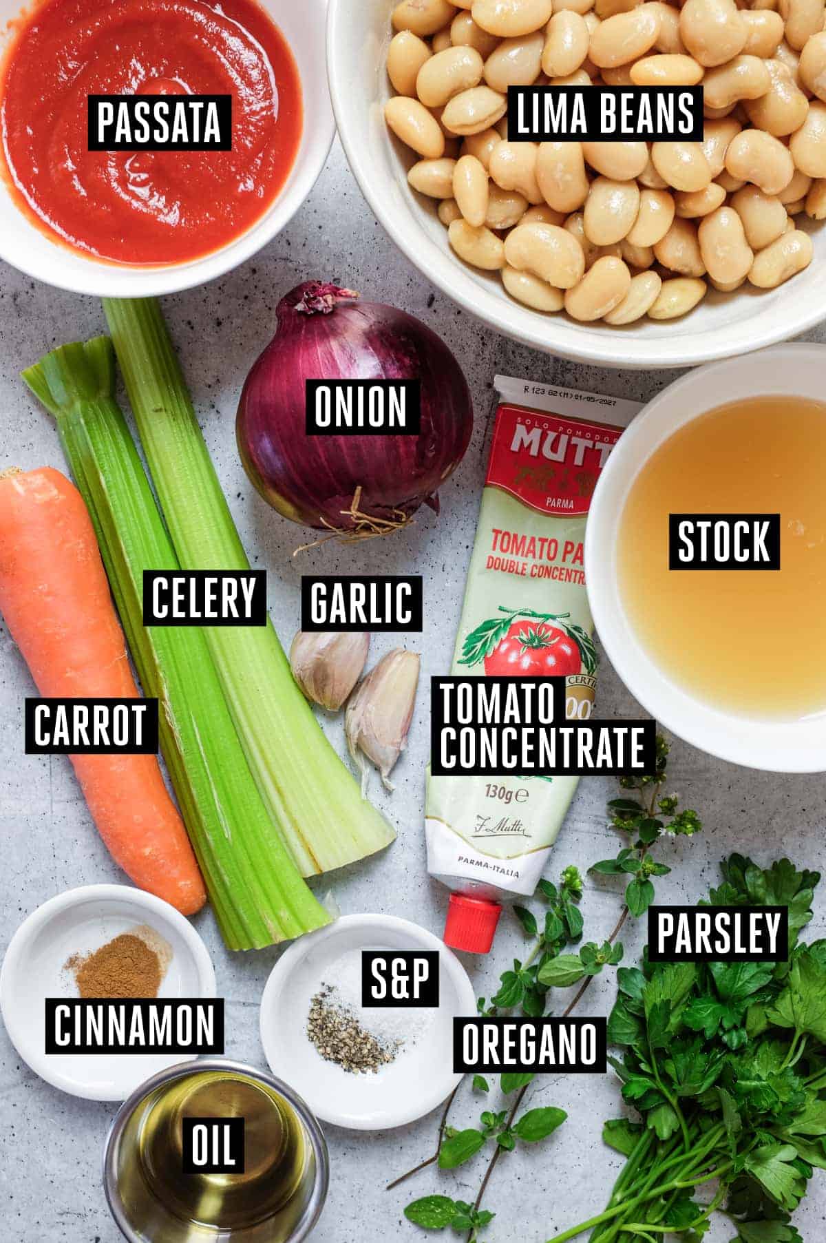 Gigantes Plaki (Quick & Easy Greek Beans in Tomato Sauce) | cookeatworld.com The ingredients (labelled) for baked Greek Gigantes Plaki. Beans, tomato passata, onion, celery, carrot, tomato puree, stock, herbs, cinnamon and salt & pepper.