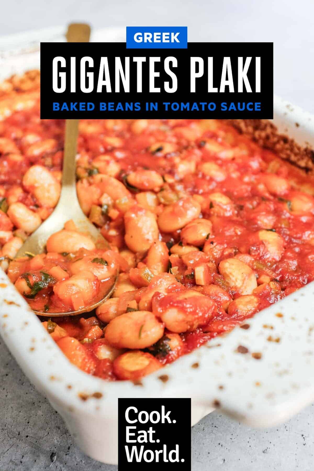 Ceramic baking dish filled with greek gigantes plaki butter beans.