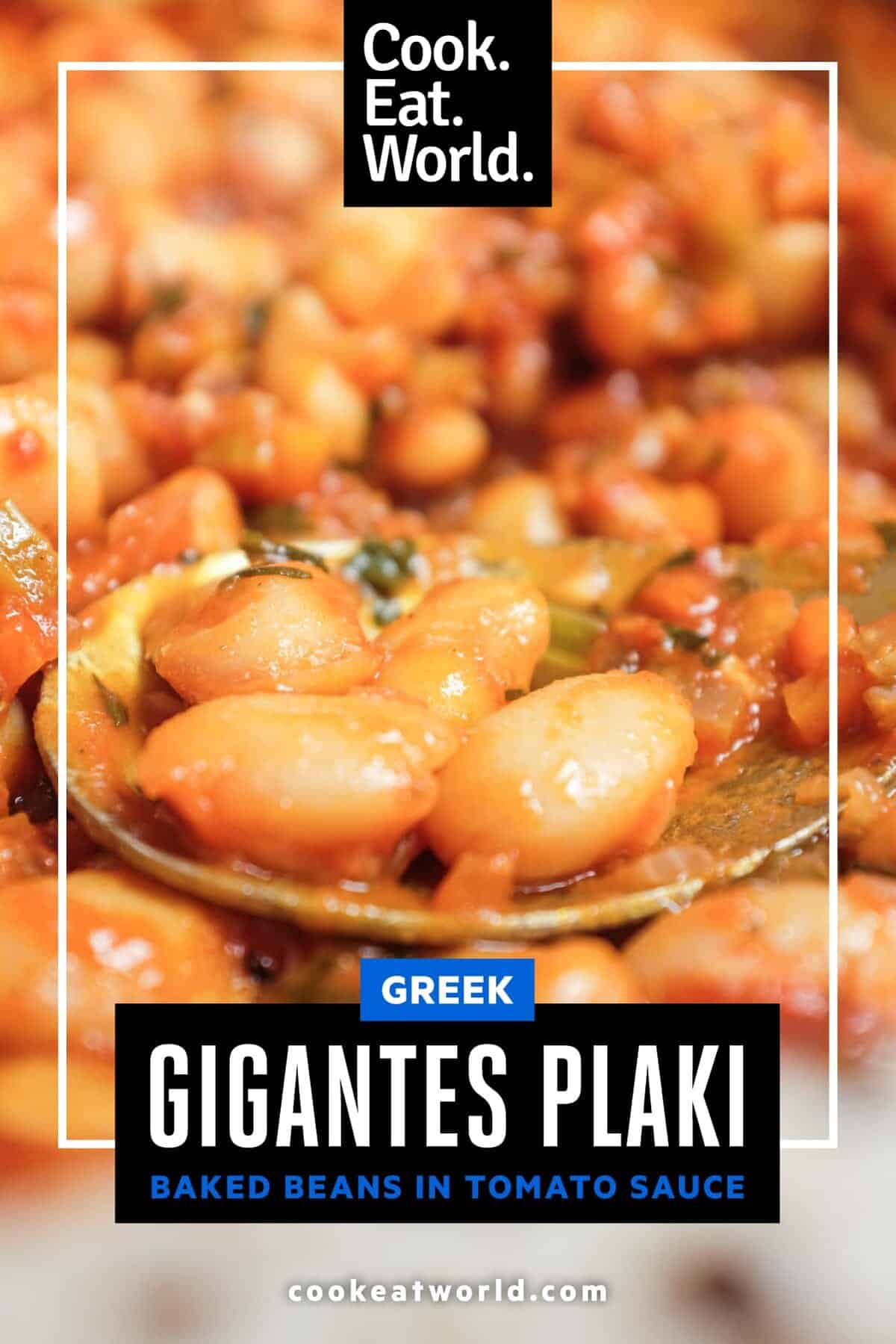 Greek gigantes plaki butter beans baked in tomato sauce in ceramic dish.