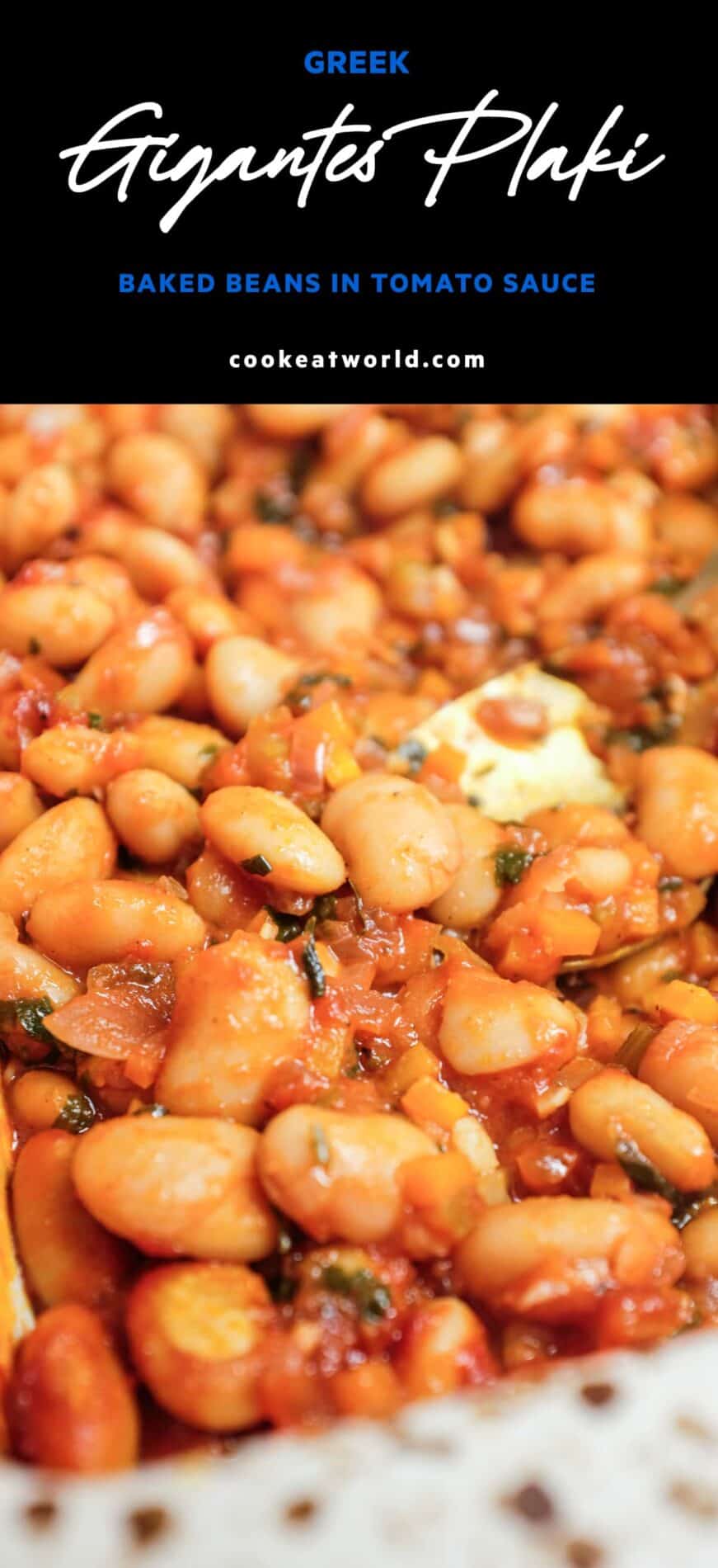 Gigantes plaki baked butter beans in tomato sauce in a ceramic baking dish.