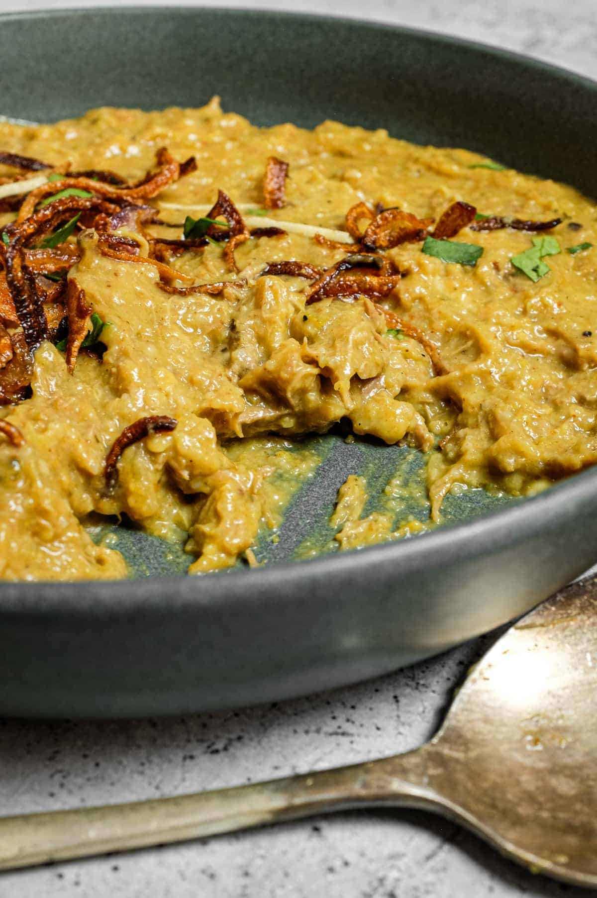 Hyderabadi lamb haleem with golden fried onions and fresh herbs