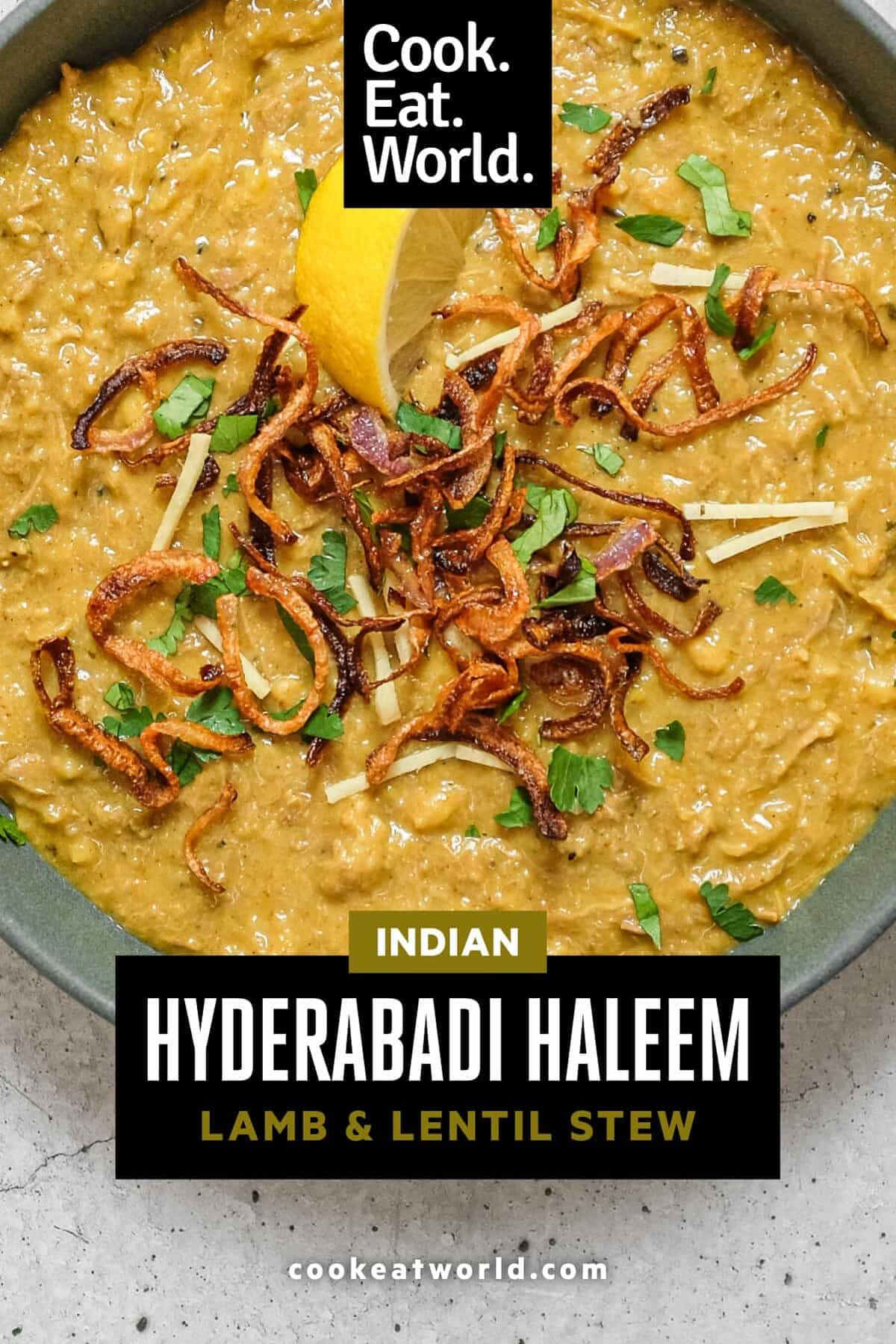 Traditional Hyderabadi haleem with lemon wedge and herb garnish