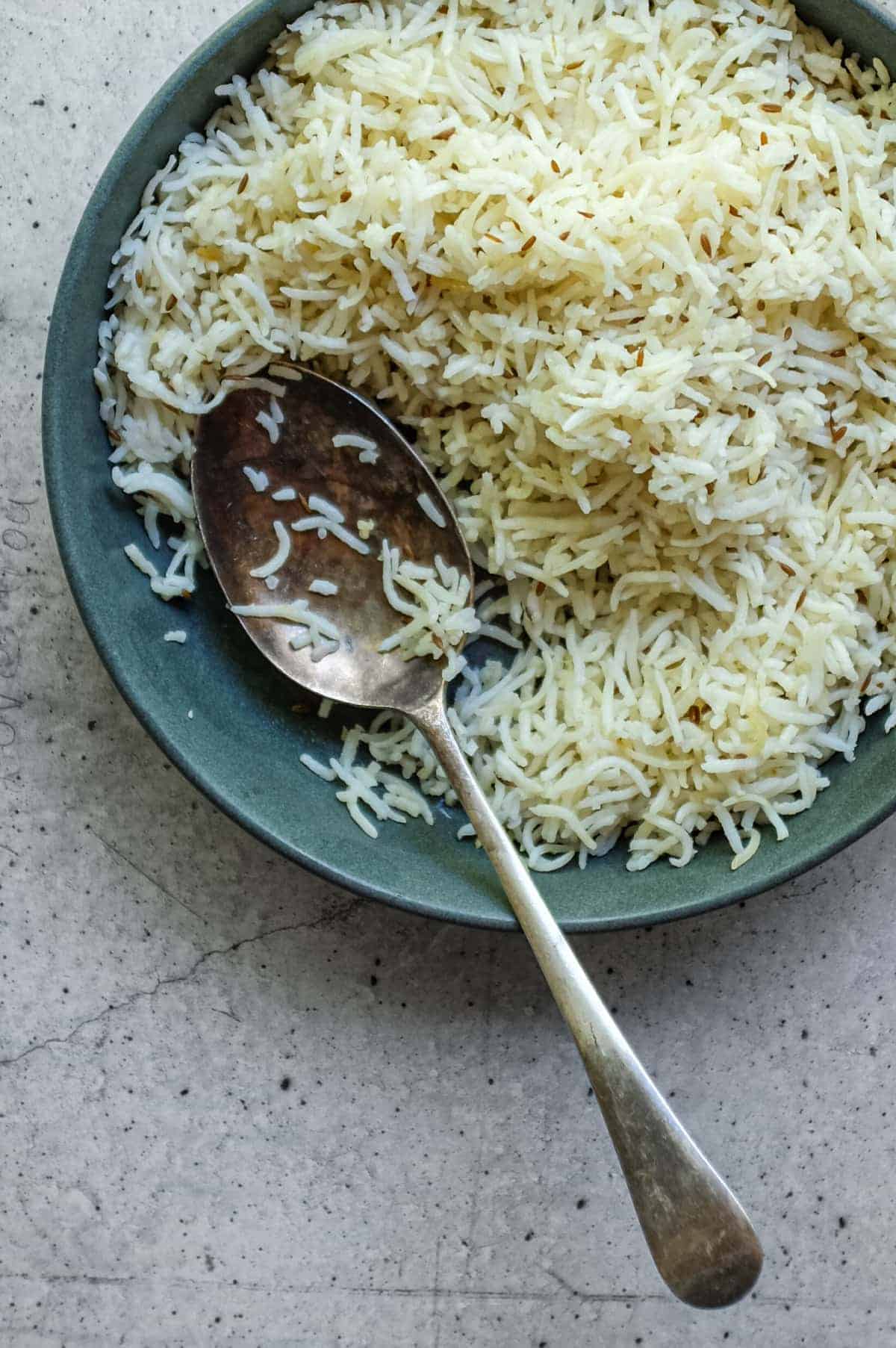Light and fluffy cumin rice ready to serve with Indian curry dishes