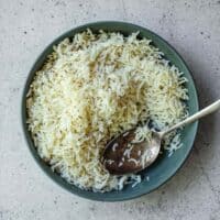 Homemade jeera rice with ghee and toasted cumin seeds in a serving bowl