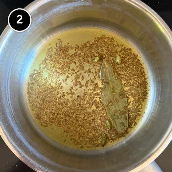 Jeera Rice (Cumin Rice) | cookeatworld.com Cumin, bay leaf and cardamom pods frying in ghee. The base for Indian Jeera Rice (Cumin Rice)