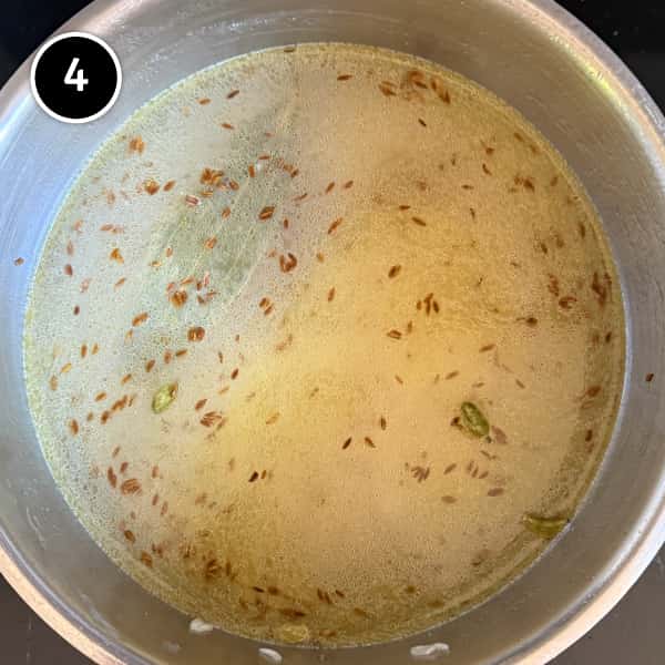 Jeera Rice (Cumin Rice) | cookeatworld.com Indian Jeera Rice (Cumin Rice) gently simmering in water