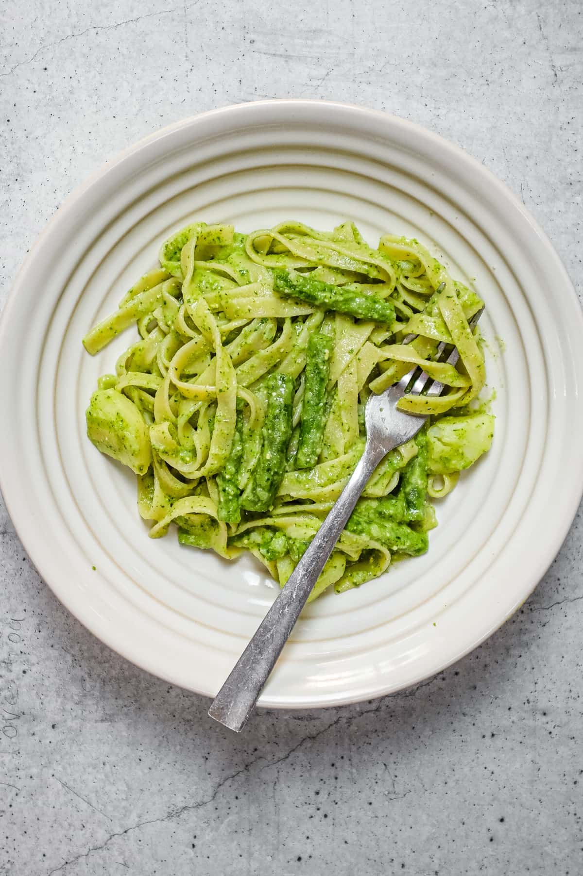 Italian pasta with basil pesto, potatoes and green beans