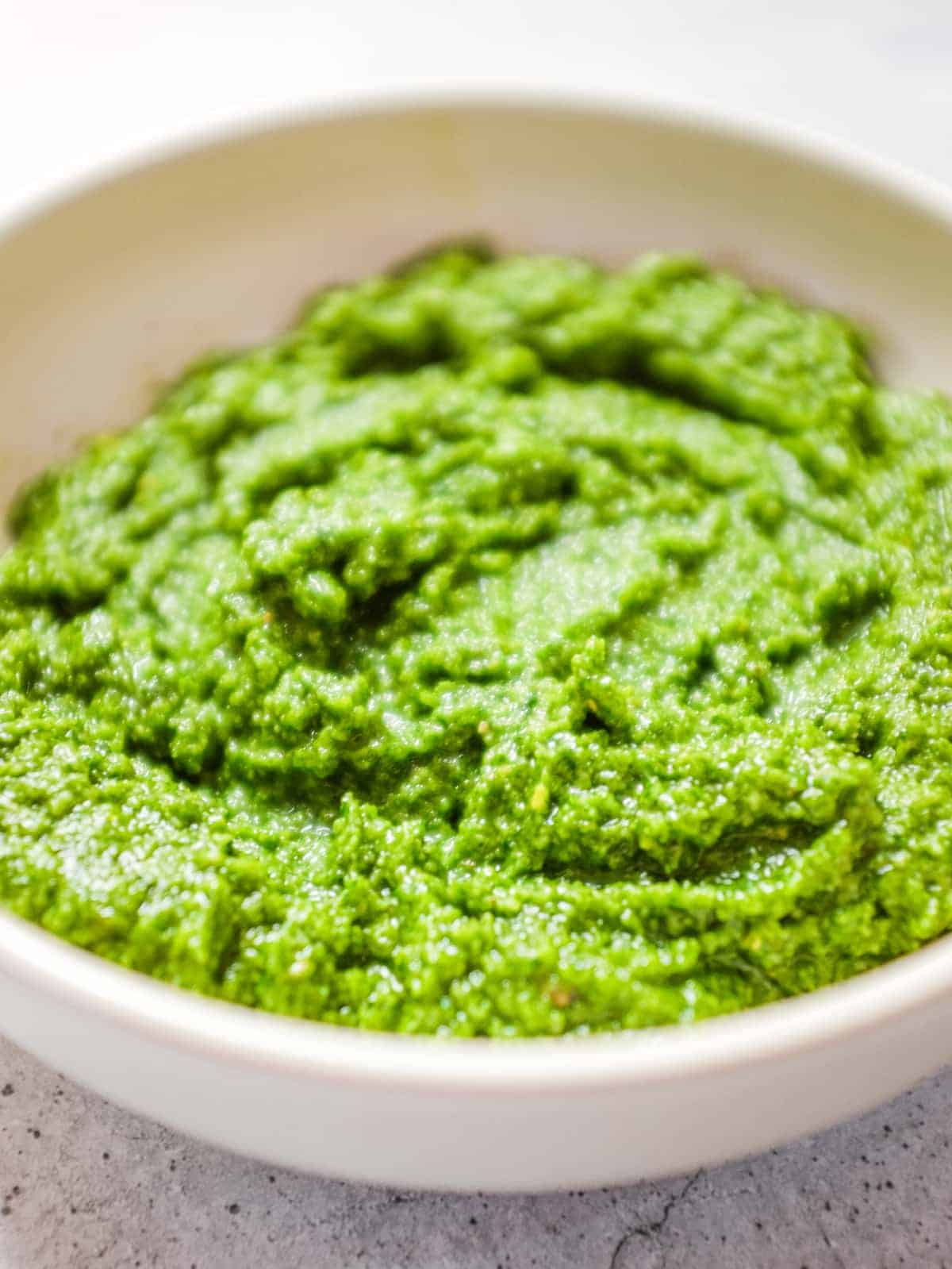 Fresh pesto pasta with green beans and potatoes on a plate
