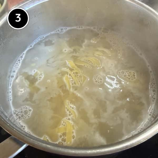 Pesto Pasta with Potatoes & Green Beans (Trenette al Pesto) | cookeatworld.com Pasta boiling in a large pot