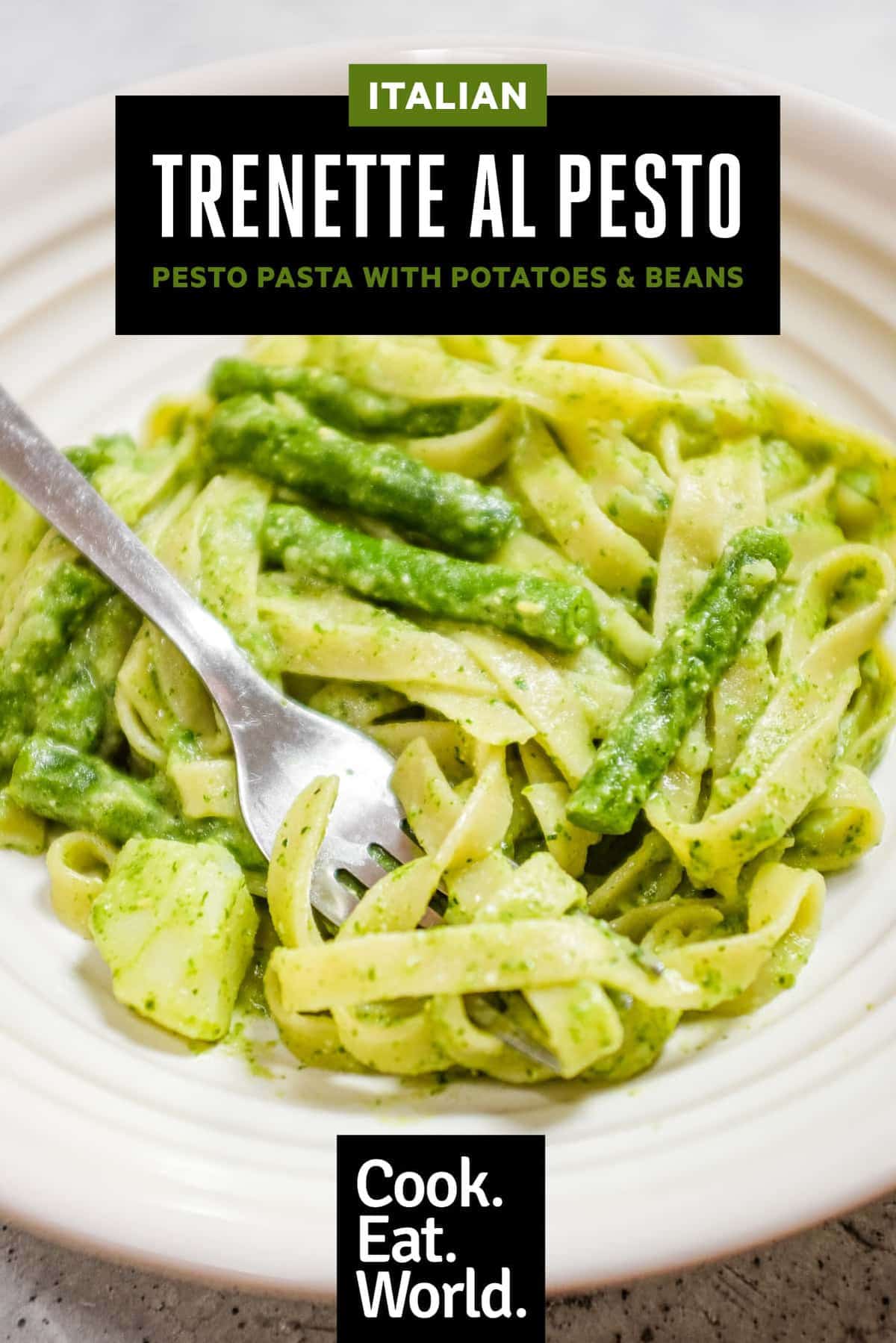 Italian pesto pasta with potatoes and green beans close-up