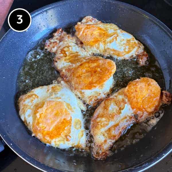 Thai Crispy Fried Egg Salad (Yam Kai Dao) | cookeatworld.com Eggs frying in peanut oil until crisp