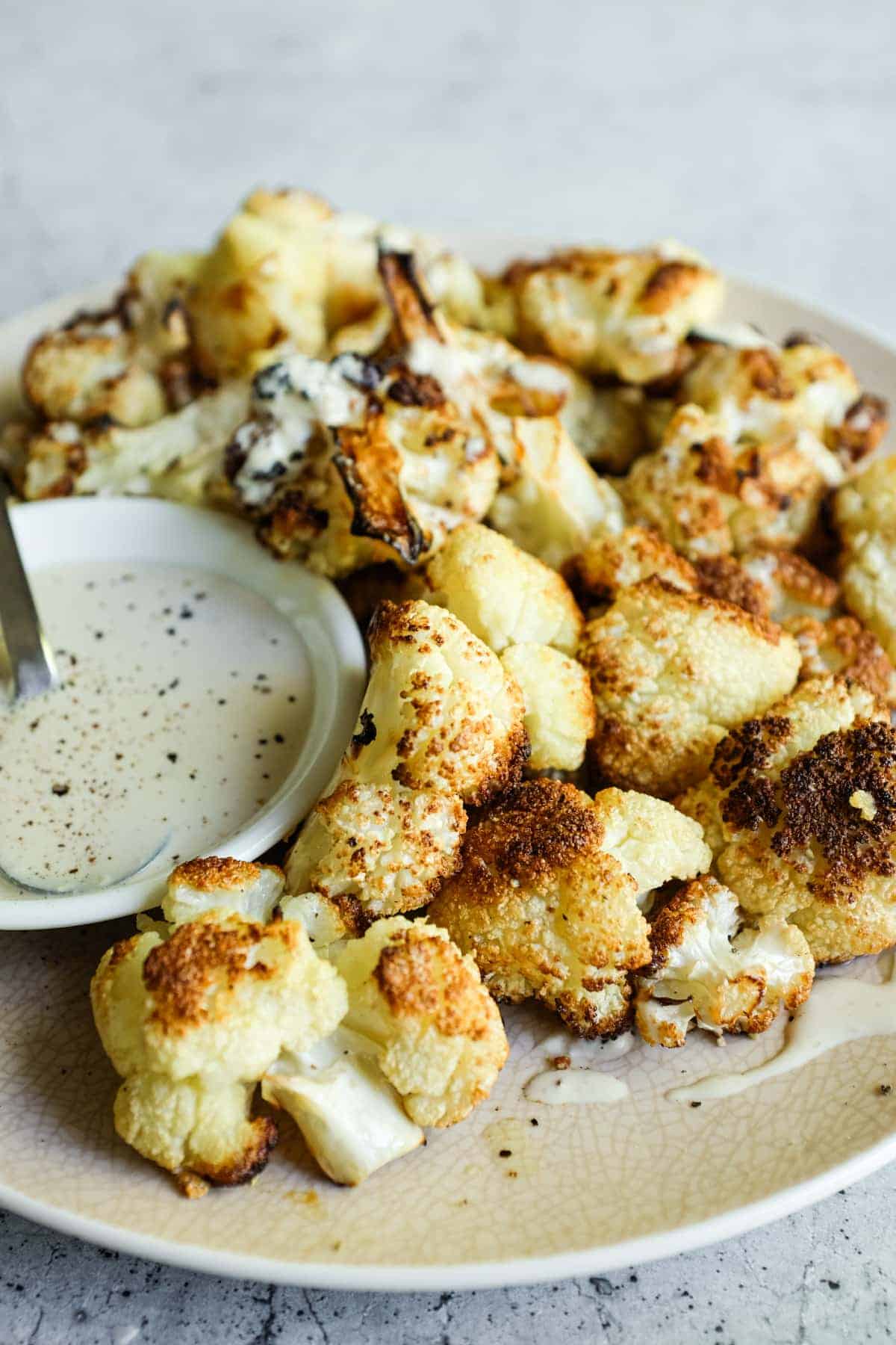 Roasted cauliflower florets with thick tahini dipping sauce