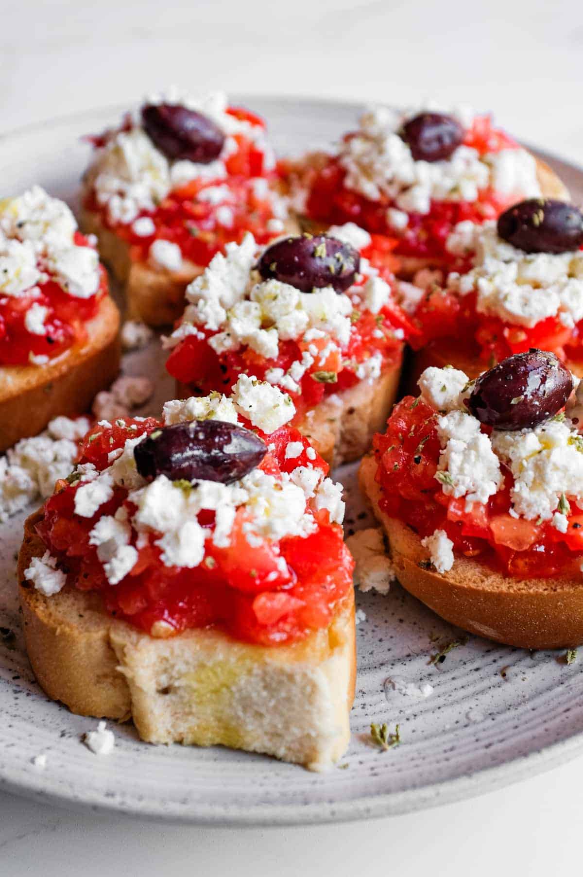 Cretan Dakos Salad | cookeatworld.com Crisp barley rusks loaded with juicy tomato and salty feta cheese