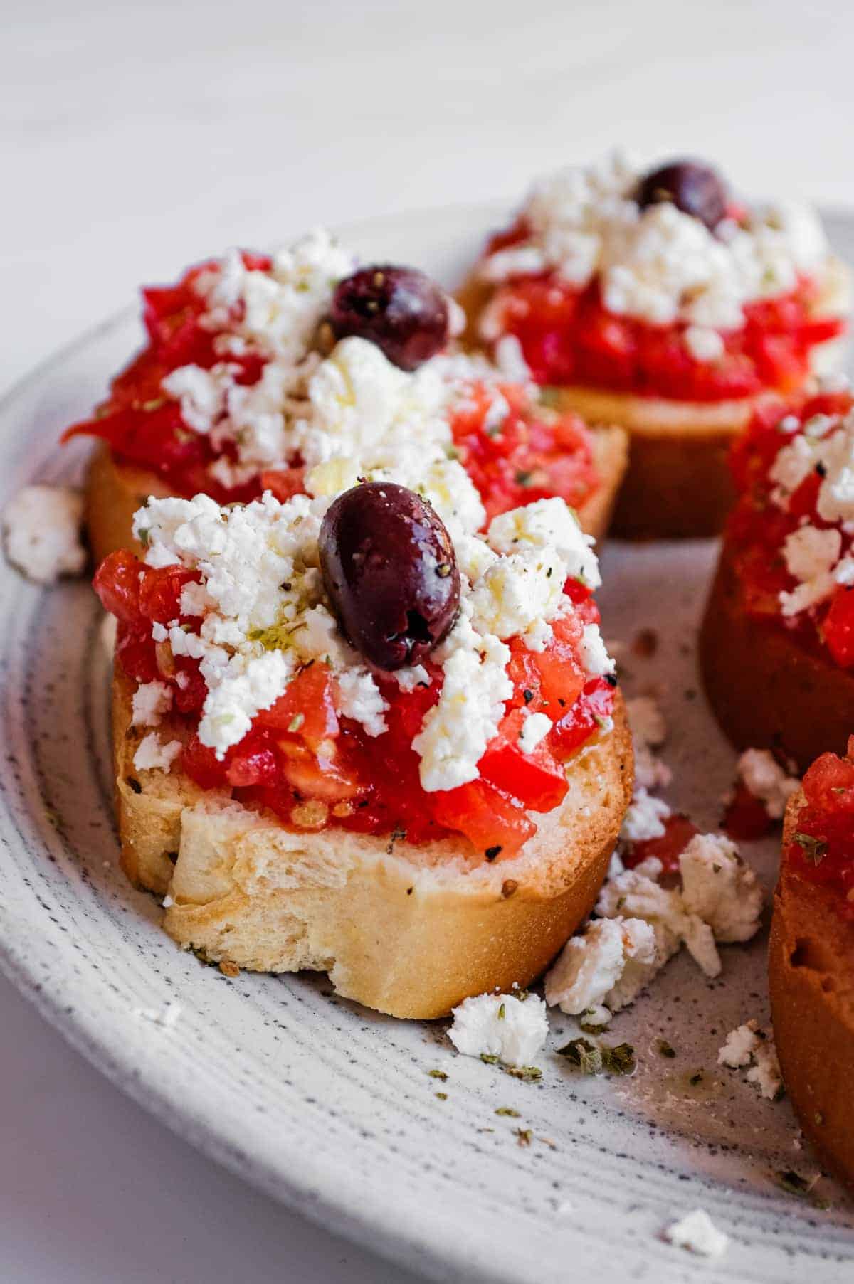 Cretan Dakos Salad | cookeatworld.com Traditional Greek dakos made with paximadia barley rusks and fresh tomato