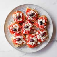 Simple Cretan tomato and feta rusks served as a Greek appetiser