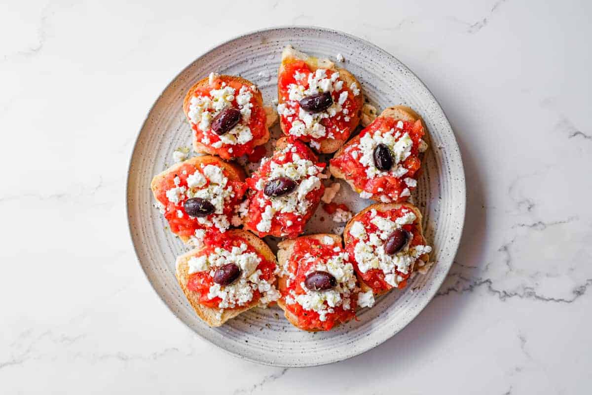 Simple Cretan tomato and feta rusks served as a Greek appetiser