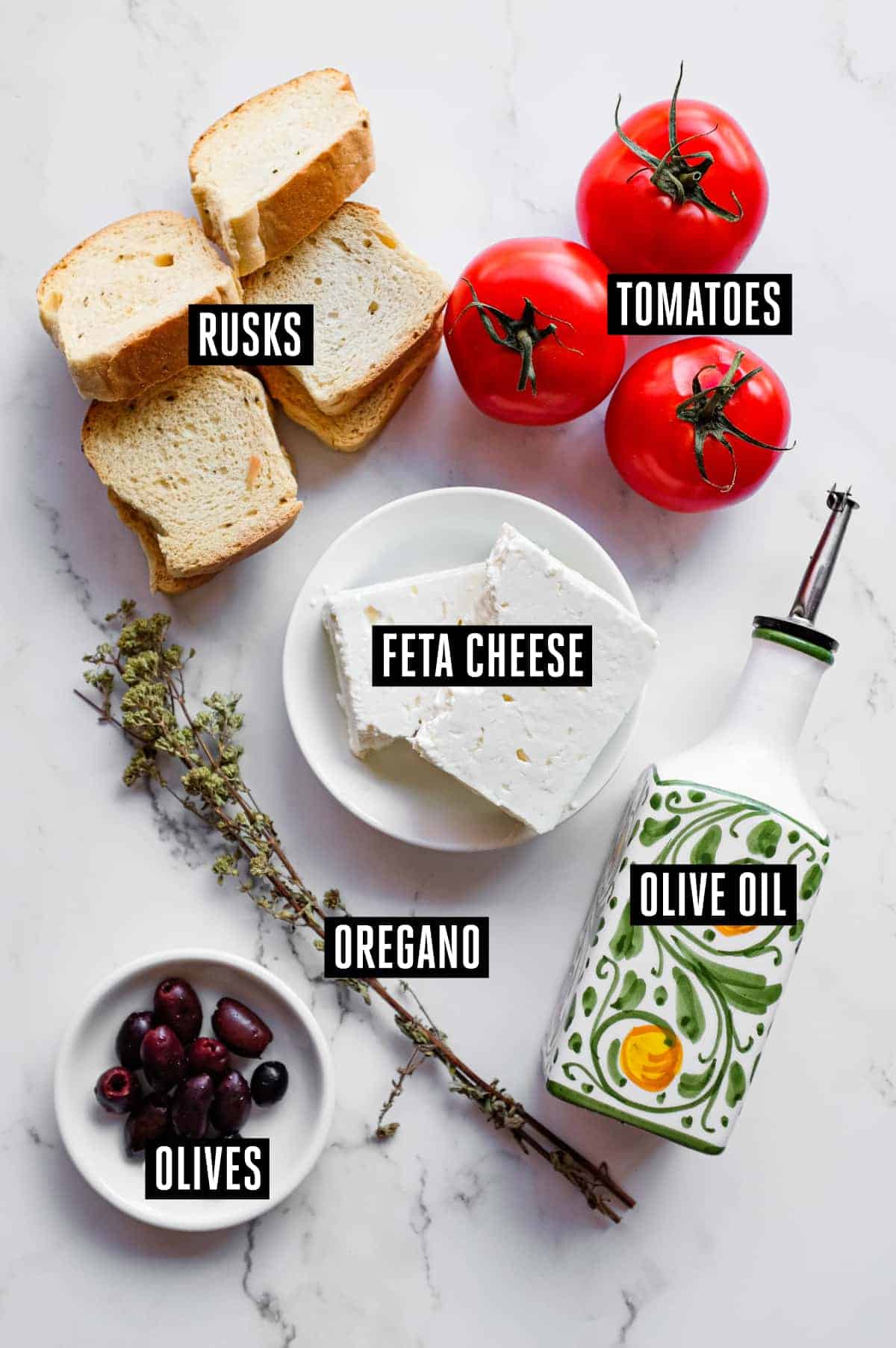 Cretan Dakos Salad | cookeatworld.com Mediterranean dakos platter with Greek olives and dried oregano