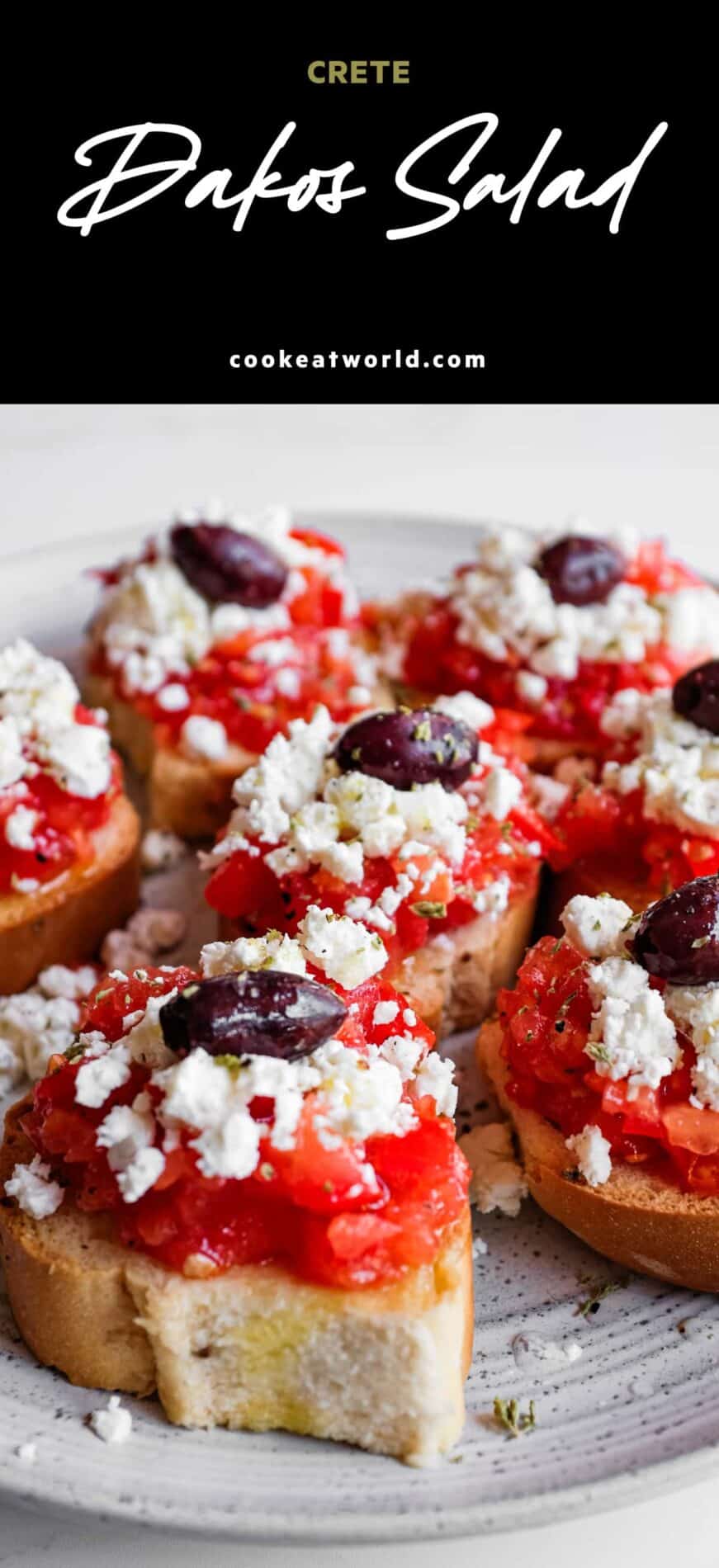 Cretan dakos topped with juicy tomato, feta and olives on crisp barley rusks