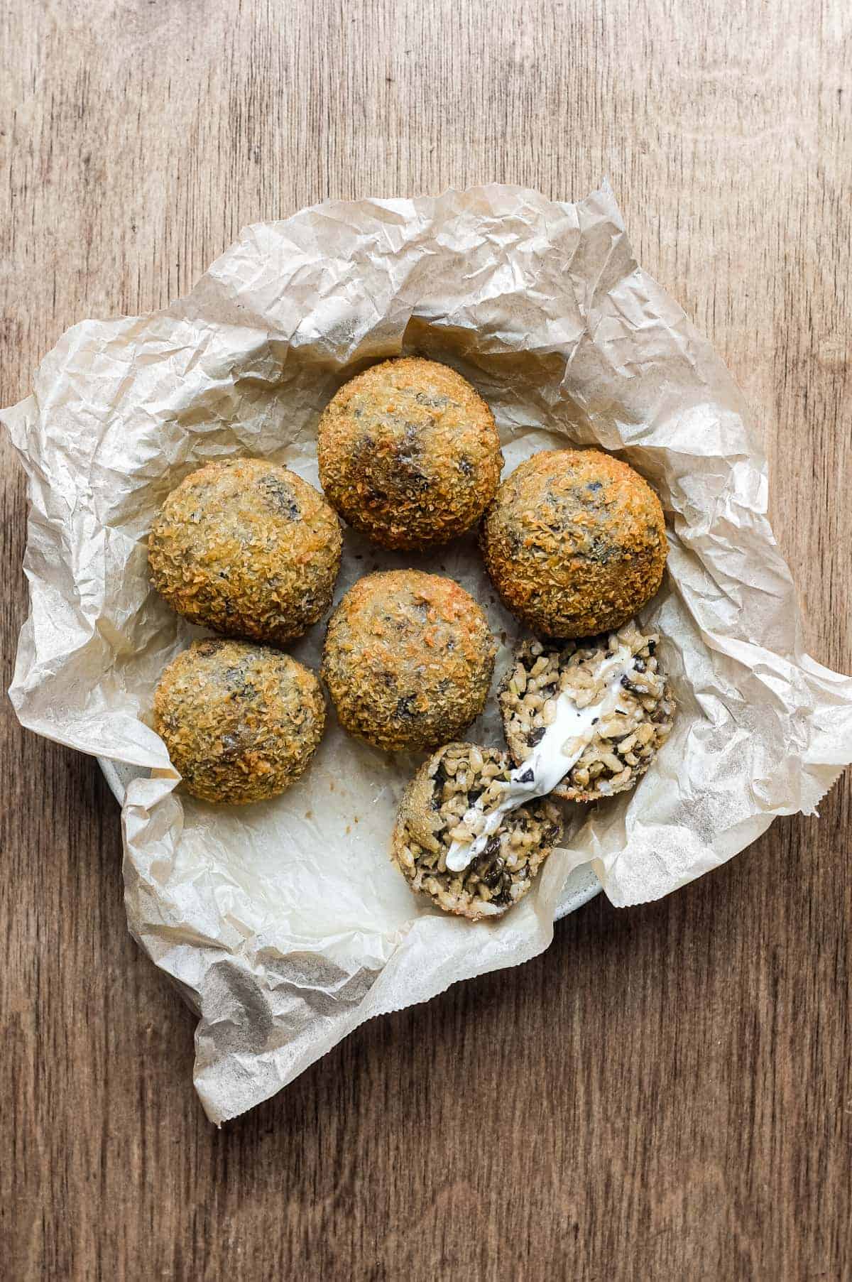 Mushroom Arancini (Crispy Italian Risotto Balls) | cookeatworld.com Homemade Sicilian-style mushroom arancini served as an Italian antipasti.