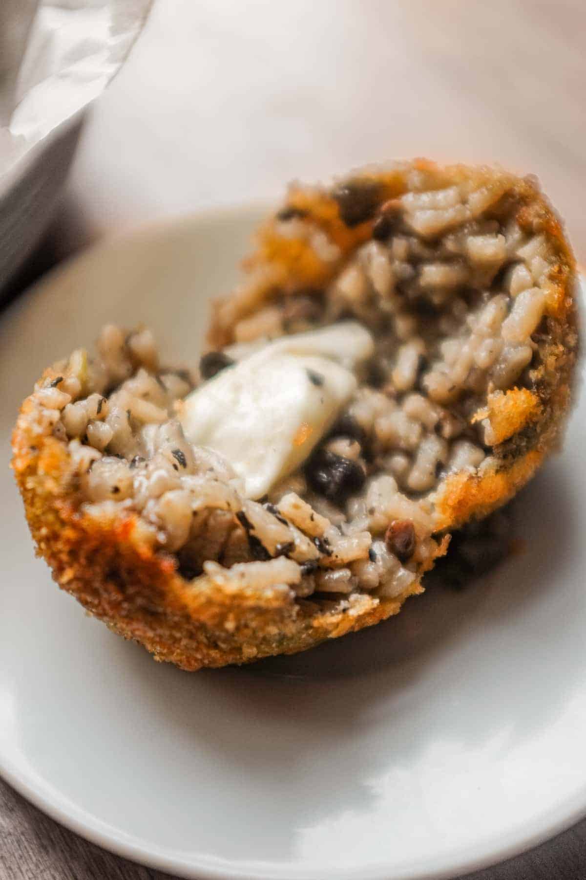Mushroom Arancini (Crispy Italian Risotto Balls) | cookeatworld.com Rustic mushroom arancini with earthy mushroom risotto and melted mozzarella filling.