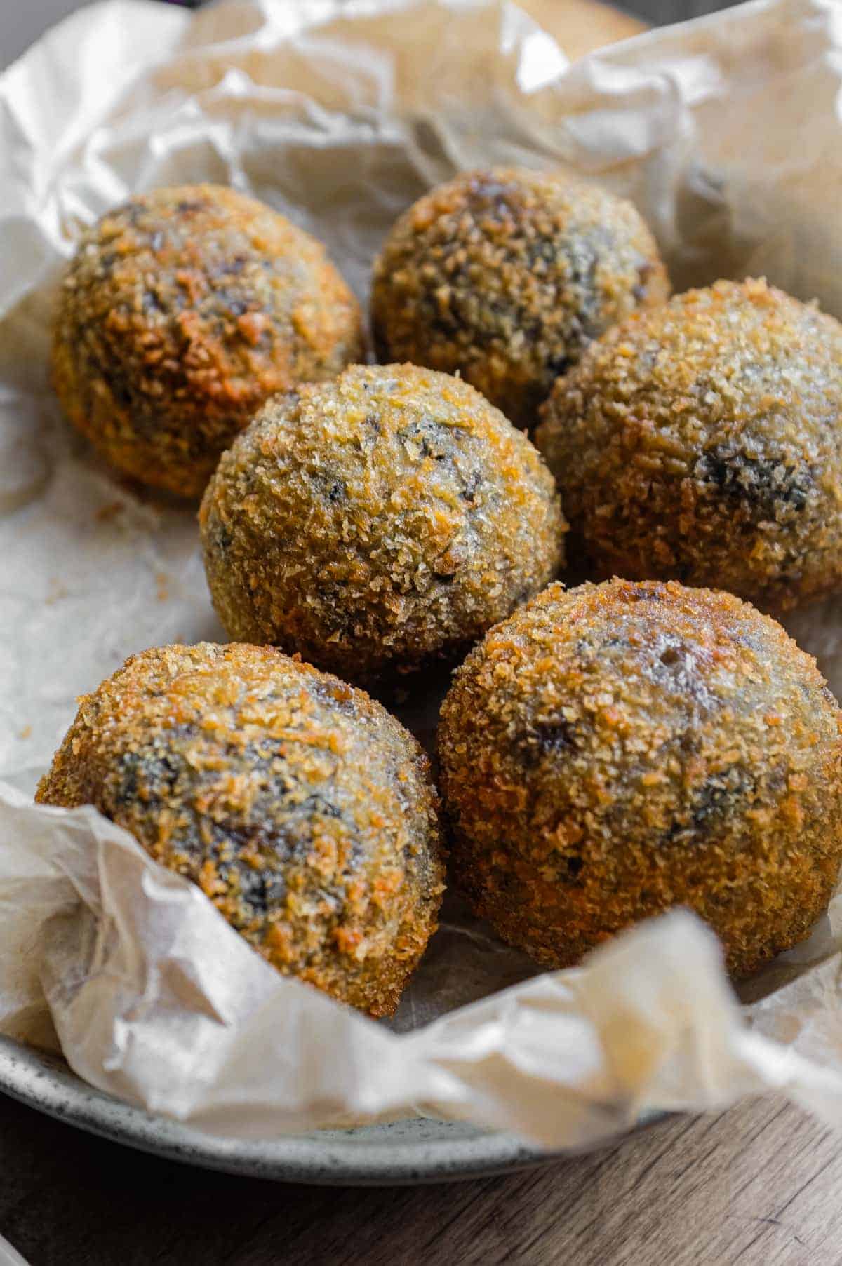 Mushroom Arancini (Crispy Italian Risotto Balls) | cookeatworld.com Crispy mushroom arancini, the perfect Italian recipe for using leftover risotto.