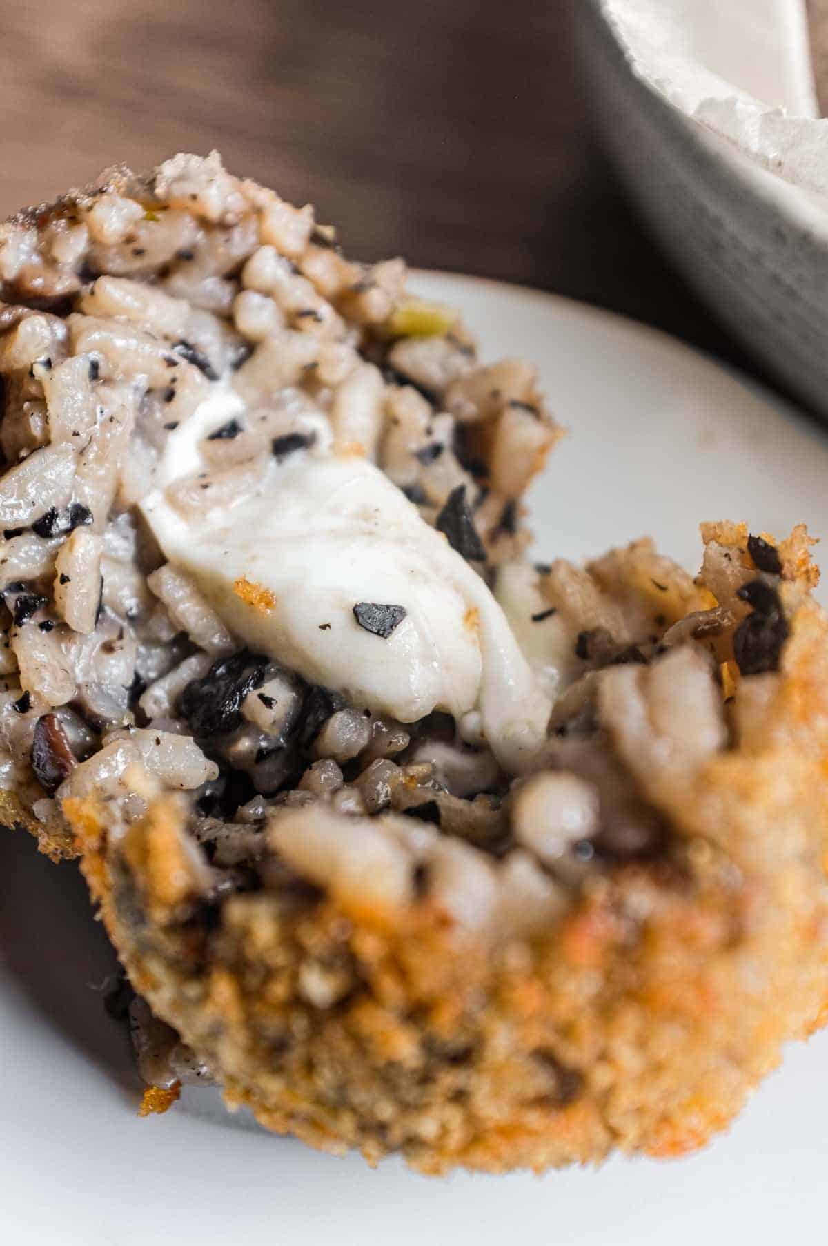 Mushroom Arancini (Crispy Italian Risotto Balls) | cookeatworld.com Rustic mushroom arancini with earthy mushroom risotto and melted mozzarella filling.