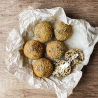 Golden fried mushroom arancini with panko breadcrumb coating on a serving platter.