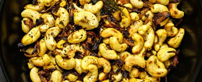 Crunchy South Indian curry leaf cashews served in a rustic bowl.