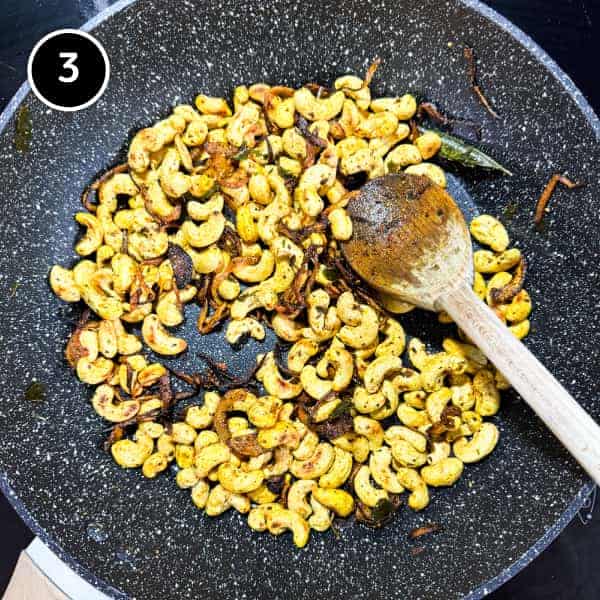 Spicy Cashew Nuts (South Indian Curry Leaf Cashews) | cookeatworld.com South Indian-style spiced cashew nuts garnished with crisp fried curry leaves.