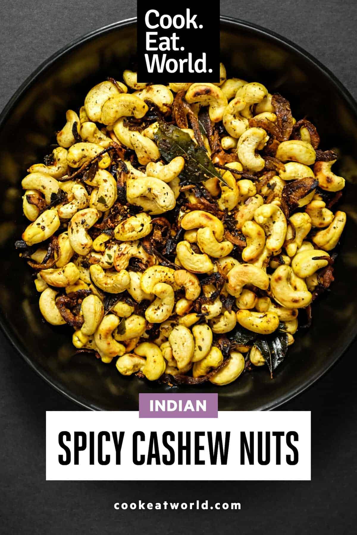 Close-up of golden cashew nuts coated in chilli and turmeric seasoning.