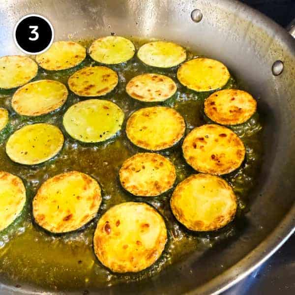 Zucchini Alla Scapece (Italian Zucchini with Mint & Vinegar) | cookeatworld.com Golden brown rounds of zucchini frying in olive oil for zucchini alla scapece