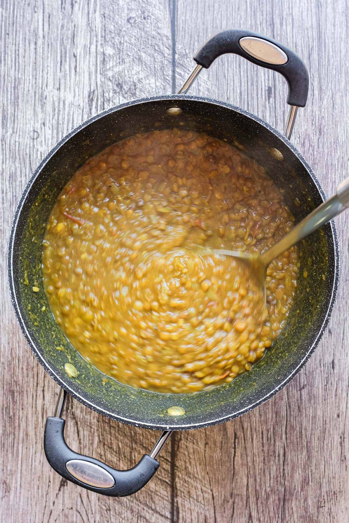 A ladleful of Persian lentil soup, adasi.