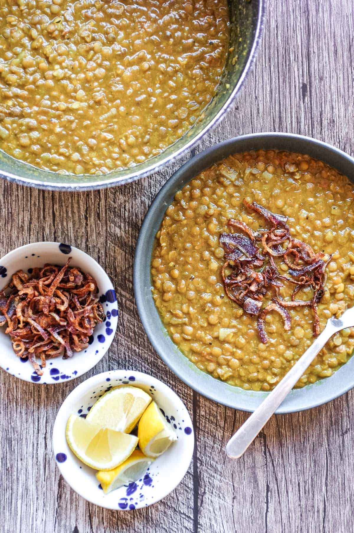 Vegan Persian lentil soup topped with crisp onion and fenugreek