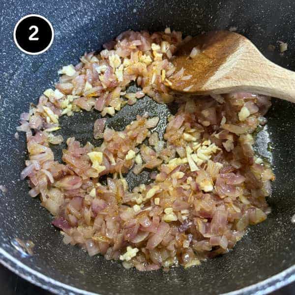 Adasi (Persian Lentil Soup) | cookeatworld.com onions caramelising with garlic for the beginning of a Persian adasi lentil soup