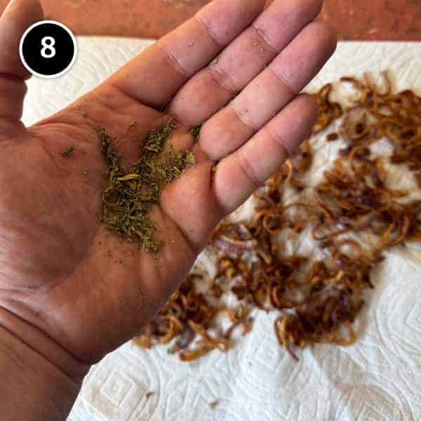Adasi (Persian Lentil Soup) | cookeatworld.com Dried fenugreek leaves being ground by hand into a rough powder